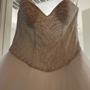 This dress is 14W never used dress and vail has detailed sequence.